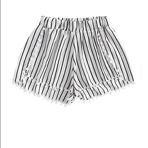 Black and white striped flowy shorts with tassels